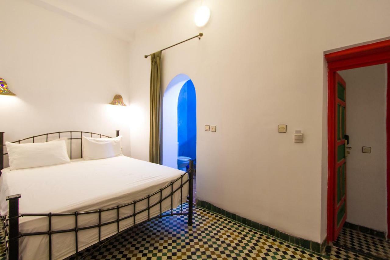 Riad Haj Palace & Spa Fès Exteriér fotografie A bedroom at the hotel